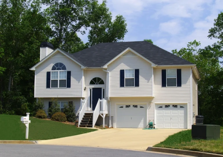 new house with dark roof and white siding commercial roof