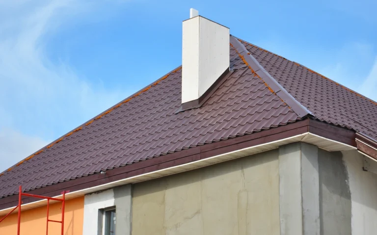 bonnet roof with dark red metal sheets and white chimney