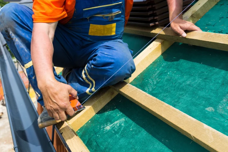 roofer measuring the roof  for better accuracy