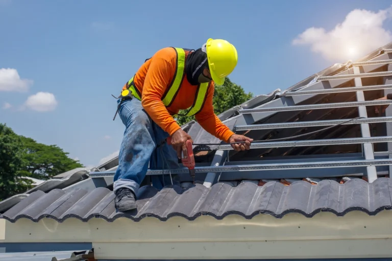worker in the middle of roof replacement process