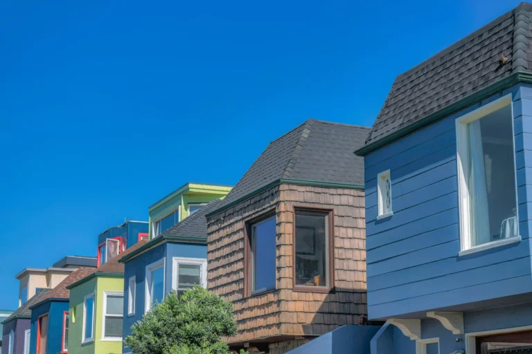 houses with colorful sidings and asphalt shingle roof in suburbs