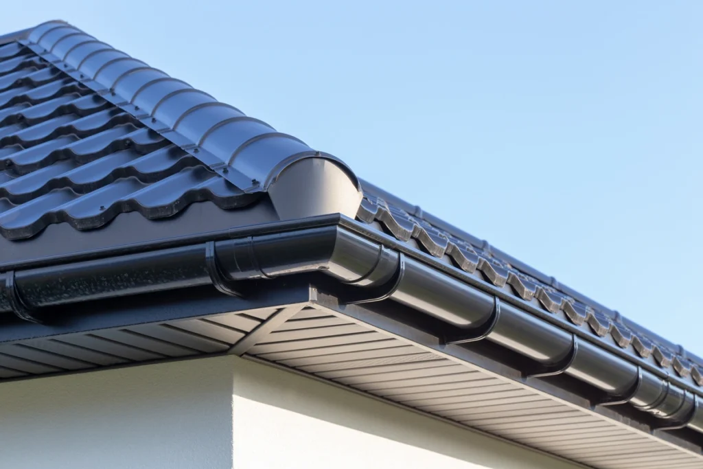 Close up view of metal shingles installed on roof with a higher value for home