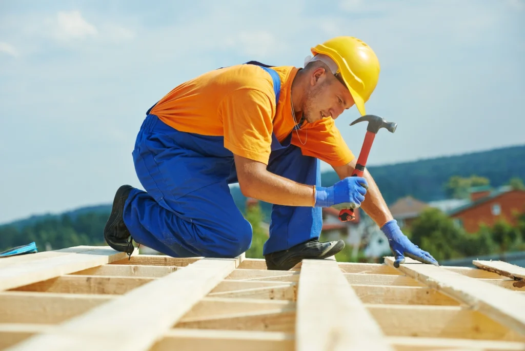 man wearing helmet on roof