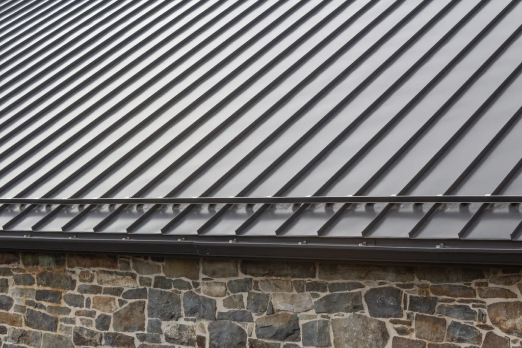 standing seam metal roof with stone siding