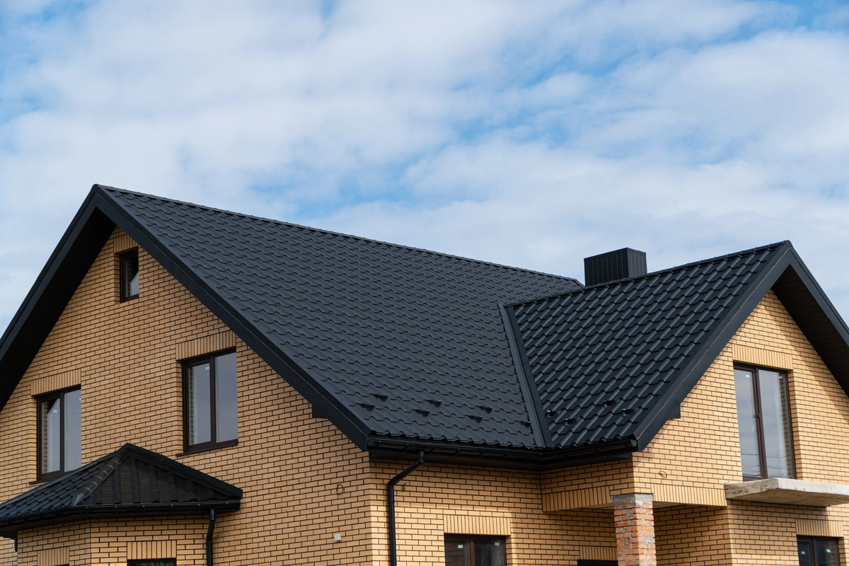 dark metal roof on brick house 1 1